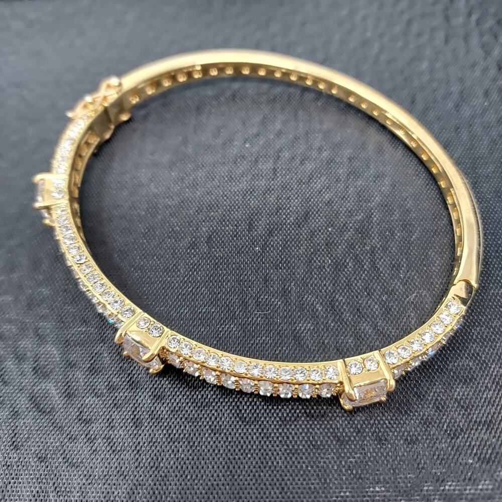 Akkad Rhinestone Gold Tone Hinged Bangle 2.5" Oval Signed